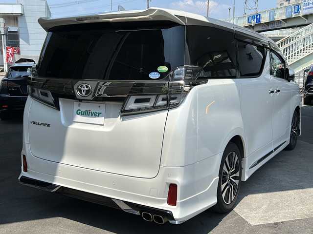 トヨタ ヴェルファイア Z Gエディション 京都府 2019(平31)年 6.8万km ホワイトパールクリスタルシャイン ワンオーナー/純正SDナビ/フルセグTV/モデリスタエアロ/サンルーフ/ＥＴＣ2.0/禁煙車/トヨタセーフティセンス/フリップダウンモニター/（V12T-R68C)/ＢＳＭ/デジタルインナーミラー/Ｄ席ポジションメモリー/前後ドライブレコーダー/ (HDR361GW)/オットマン/3列シート/パワーシート/  D席、N席、2列目/合皮シート/シートヒーター/   D席、N席有/エアシート/   D席、N席有/両側パワースライドドア/バックカメラ/レーンキープアシスト/3眼LED