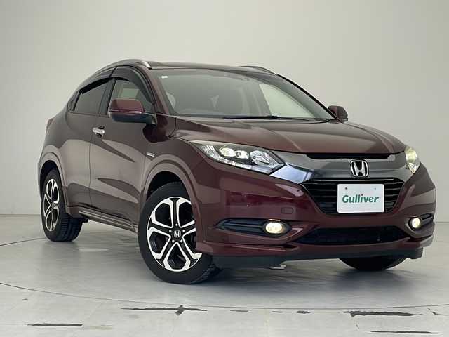 ホンダ ヴェゼル ハイブリッド Z 沖縄県 2014(平26)年 7.8万km プレミアムディープロッソパール 社外ナビ(AVIC-ZH0009)/（フルセグＴＶ　ＤＶＤ再生　Bluetooth接続）/バックカメラ/ETC/クルーズコントロール/パドルシフト/シートヒーター/レザーシート/スマートキー/プッシュスタート/LEDヘッドライト/オートライト/純正フロアマット/純正17インチアルミホイール/ドアバイザー/電動格納ウインカーミラー