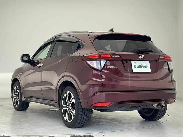 ホンダ ヴェゼル ハイブリッド Z 沖縄県 2014(平26)年 7.8万km プレミアムディープロッソパール 社外ナビ(AVIC-ZH0009)/（フルセグＴＶ　ＤＶＤ再生　Bluetooth接続）/バックカメラ/ETC/クルーズコントロール/パドルシフト/シートヒーター/レザーシート/スマートキー/プッシュスタート/LEDヘッドライト/オートライト/純正フロアマット/純正17インチアルミホイール/ドアバイザー/電動格納ウインカーミラー