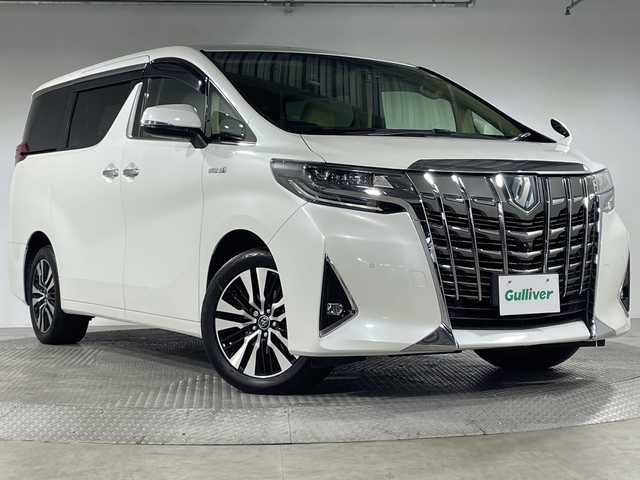トヨタ アルファードハイブリット X 神奈川県 2018(平30)年 5.2万km パール 4WD/社外アルパイン11型メモリーナビゲーション【EX11Z】/社外アルパインフリップダウンモニター【PXHEX-R-AV】/ワンセグ　CD DVD　SD　iPod　Bluetooth　AUX　HDMI　/サイド/リアカメラ/両側電動スライドドア/デジタルインナーミラー/AC100V/純正ビルトインETC/セーフティセンス/レーダークルーズコントロール/プリクラッシュセーフティ/レーントレーシングアシスト/パーキングサポートブレーキ/ロードサインアシスト/先行車発進お知らせ機能/前後ソナー/ハイビームアシスト/2列目オットマン/社外前方ドライブレコーダー/革巻きステアリング/電動パーキングブレーキ/オートブレーキホールド/プッシュスタート/スマートキー/LEDヘッドランプ/フロントフォグランプ/オートライト/純正18インチアルミホイール/純正リアスポイラー/取説　保証書　スペアキー