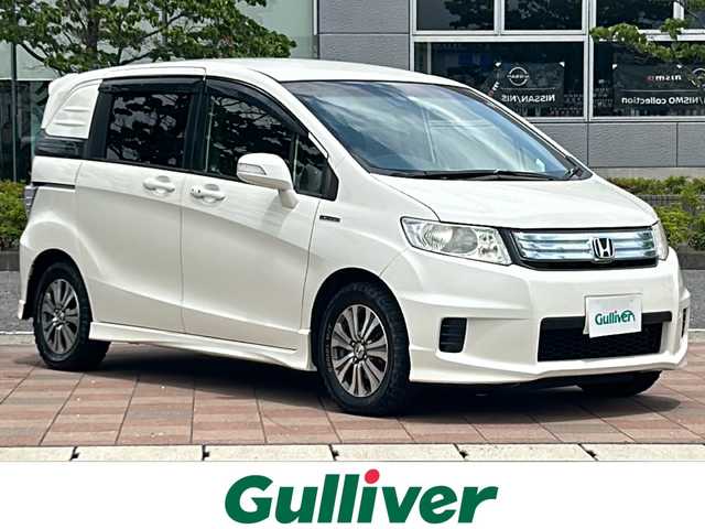 ホンダ フリード スパイク ハイブリット ジャストセレクション 福島県 2012(平24)年 11.7万km プレミアムホワイトパール 純正ナビゲーション/型番：VXM-135VFN/【CD/DVD/SD/TV】/フリップダウンモニター/型番：VM-108N/バックカメラ/ETC/両側電動スライドドア/オートライト/ステアリングリモコン/シートバックテーブル/純正フロアマット/ドアバイザー
