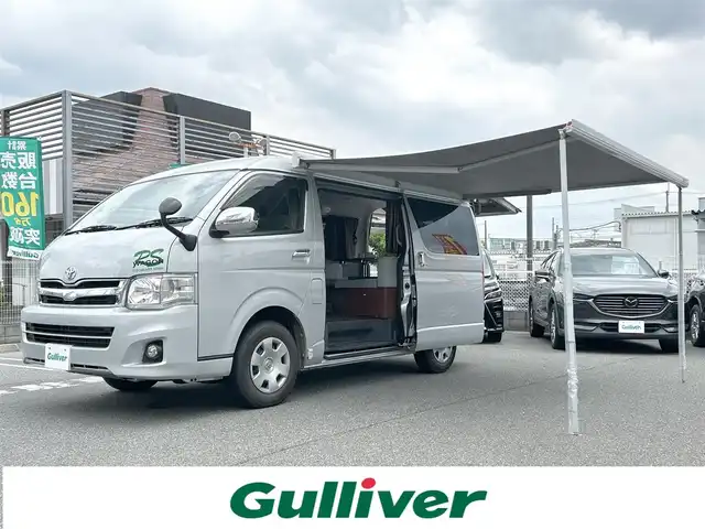 トヨタ ハイエース GL ロング 奈良県 2011(平23)年 4.2万km シルバー フリップダウンモニター１２インチ/ロール式テント（ＦＩＡＭＭＡ　Ｆ４５Ｓ）/片側パワースライドドア/社外ナビ【ＮＲ－ＭＺ０３】（ＣＤ／ＤＶＤ／ＢＴ）/ＡＣ１００Ｖ/ＥＴＣ/スペアキーｘ１/バックカメラ/カーテン後付け/フォグ/純正ドアバイザー/純正フロアマット/オートエアコン