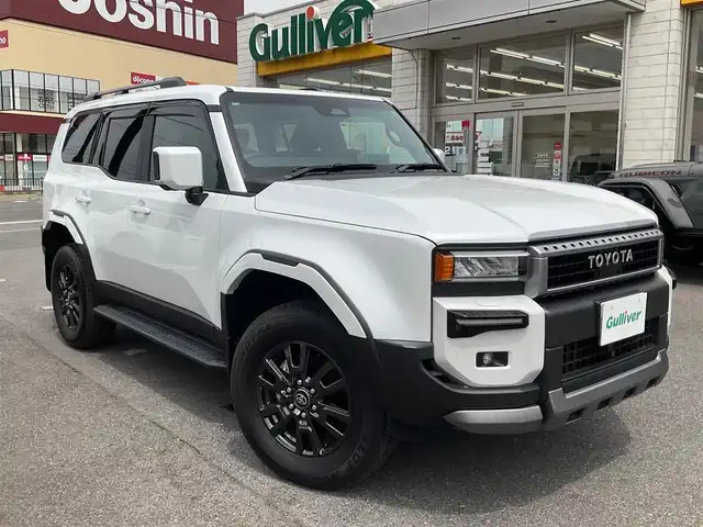 トヨタ ランドクルーザー ２５０ VX 滋賀県 2024(令6)年 0.2万km プラチナホワイトパールマイカ ワンオーナー/令和9年10月まで/モデリスタエアロ/フロントバンパーガード/リアバンパーガーニッシュ/オーバーフェンダー/リアスポイラー/トヨタセーティセンス/ブラインドスポットモニター/パーキングサポートブレーキ/12.3インチディスプレイオーディオ/パノラミックビューモニター/ETC2.0/デジタルインナーミラー/サンルーフ/ブラックレザーシート/パワーシート、シートヒーター/パワーバックドア/スペアキー有り/取扱説明書、保証書/