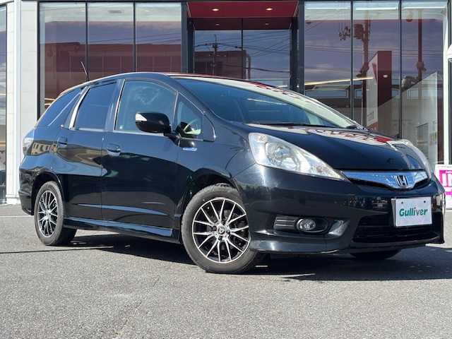 ホンダ フィット シャトル ハイブリッド スマートセレファインライン 宮城県 2013(平25)年 12.1万km クリスタルブラックパール 登録時走行距離120926km/SDナビ/CD/AM/FM/アイドリングストップ/横滑り防止/ETC/ステアリングリモコン/シートヒーター/寒冷地仕様/クルーズコントロール/オートライト/プッシュスタート/スマートキー/バックカメラ/純正フロアマット/フォグランプ