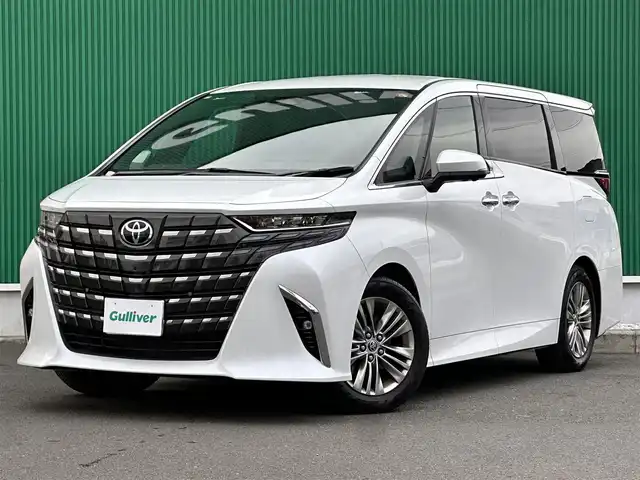 トヨタ アルファード Z 宮城県 2025(令7)年 0.5万km プラチナホワイトパールマイカ 左右独立ムーンルーフ/ユニバーサルステップ/＝＝＝/セーフティセンス/・プリクラッシュセーフティ/・レーントレーシングアシスト/・全車速追従機能付レーダークルーズコントロール/・アダプティブハイビームシステム/・ドライバー異常時対応システム/・プロアクティブドライビングアシスト/・発進遅れ告知機能/ブラインドスポットモニター/パーキングサポートブレーキ（前後方静止物/後方接近車両/後方歩行者）/床下透過表示機能付パノラミックビューモニター/14インチディスプレイオーディオ/・コネクティッドナビ対応14インチディスプレイ/・ナビ/・地デジTV/・USB/HDMI/・AppleCarPlay/AndroidAuto/・ETC2.0/ワイヤレス充電器/AC100V/1500W/デジタルインナーミラー/予約ロック機能付パワースライドドア（両側）/予約ロック機能付パワーバックドア/合皮シート/パワーシート（運転席メモリー機能付）/シートヒーター/ベンチレーション/ステアリングヒーター/電動パーキングブレーキ/ブレーキホールド/純正18インチAW