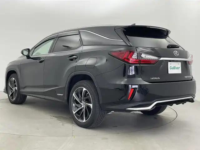 レクサス ＲＸ 450hL 富山県 2018(平30)年 6.5万km グラファイトブラックガラスフレーク 純正ナビ（AM/FM/CD/DVD/BD/AUX/USB/BT）/フルセグTV/パノラミックビューモニター/Fスポーツグリル/TRDフロントエアロ/サンルーフ/プリクラッシュセーフティ/レーンキーピングアシスト/オートマチックハイビーム/レーダークルーズコントロール/ブラインドスポットモニター/クリアランスソナー/ヘッドアップディスプレイ/本革シート（ノーブルブラウン）/1列目メモリ付きシート/パワーシート/1/2列目シートヒーター/1列目エアシート/電動格納サードシート/ステアリングヒーター/純正20インチAW/3眼LEDヘッドライト/LEDフォグランプ/シーケンシャルランプ/置くだけ充電/100V充電/デジタルインナーミラー/ドライブレコーダー前後/ビルトインETC2.0/パドルシフト/オートブレーキホールド/電動パーキングブレーキ/純正フロアマット/スペアキー/カードキーあり/プッシュスタート/取扱説明書/保証書