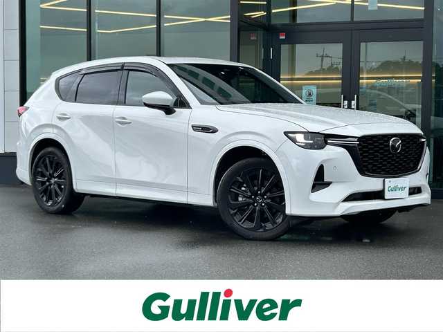 マツダ ＣＸ－６０ XD HV プレミアムスポーツ 東京都 2023(令5)年 2.7万km 白  i‐ACTIVSENSE/・スマートシティブレーキサポート/・車線逸脱警報システム/・レーンキープアシスト/・レーダークルーズコントロール/・クルージング & トラフィック・サポート /・誤発進抑制制御/・発進時前方認知/・交通標識認識システム/・ブラインドスポットモニタリング/・アクティブドライビングディスプレイ/・360°ビューモニター/純正ナビ/グラスルーフ/BOSEオーディオ/ドライブレコーダー/ETC/レザーシート/エアシート/シートヒーター/ステアリングヒーター/20インチ純正アルミホイール/アイドリングストップ/100V電源/パドルシフト