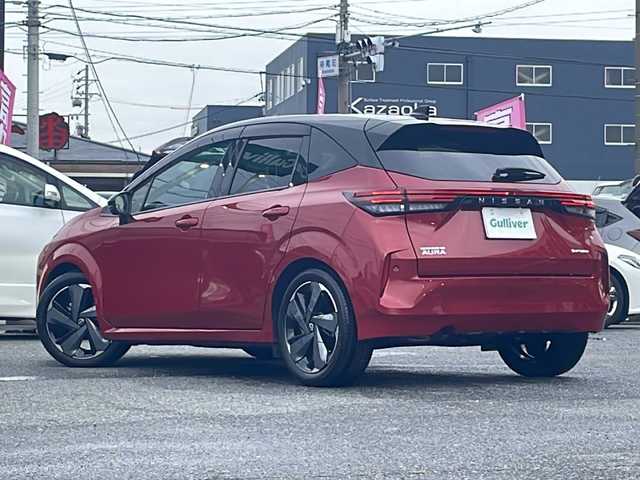 日産 オーラ G レザーエディション 愛知県 2022(令4)年 1.3万km ガーネットレッド/スーパーブラック 2トーン /禁煙車/ワンオーナー/プロパイロット//純正ディスプレイオーディオ//ナビ/フルセグ/USB/BT/HDMI/Apple Carplay//ワイヤレス充電器//BOSEサウンド//前席USB・TypeC/後席USB//ビルトインETC2.0//SOSコール//純正フロアマット//純正AW//純正ドアバイザー//プッシュスタート//オート電子パーキング//デジタルインナーミラー//前後ドライブレコーダー//バック・全方位カメラ//電格ミラー//前後クリアランスソナー//追従機能付クルーズコントロール//前席シートヒーター//D席パワーシート//本革巻きステアリング//ステアリングヒーター//ステアリングスイッチ//LEDヘッドライト//オートライト//オートマチックハイビーム//フォグランプ//エマージェンシーブレーキ//レーンキープアシスト（LDW）//BSM//ふらつき防止//Wエアバッグ//サイドエアバッグ//取扱説明書（ドラレコ・ナビ）//新車時保証書//ディーラー整備記録簿/R4.R5.R6//スペアキー