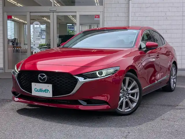 マツダ マツダ３セダン 20S Lパッケージ 埼玉県 2019(令1)年 1.1万km ソウルレッドクリスタルM ワンオーナー/純正ディスプレイオーディオ/追従機能つきクルーズコントロール/フルセグTV/Bluetoothオーディオ/CD/DVD再生/バックカメラ/ETC/ステアリングヒーター/シートヒーター（運転席/助手席）/プッシュスタート/LEDヘッドライト/スマートキー×2
