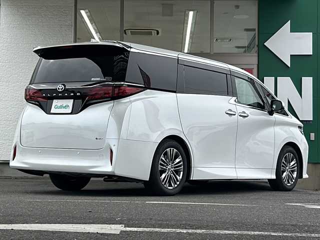 トヨタ アルファードハイブリット Z 愛知県 2024(令6)年 1.4万km プラチナホワイトパールマイカ 禁煙車/法人ワンオーナー/純正メーカーナビ、TV/パノラミックビューモニター/レザーシート/独立サンルーフ/両側パワースライドドア/トヨタチームメイト/自動駐車/ユニバーサルステップ/ヘッドアップディスプレイ/ブラインドスポットモニター/フリップダウンモニター/デジタルインナーミラー/アダプティプクルーズコントロール/レーンキープアシスト/パドルシフト/置くだけ充電/HDMI/前後コーナーセンサー/クリアランスソナー/Bluetooth/Miracast/ステアリングリモコン/ハンドルヒーター/シートヒーター（セカンドシートまで）/エアシート（セカンドシートまで）/パワーシート/メモリーシート/オットマン/後席サンシェード/AUTOHOLD/純正18アルミ/純正フロアマット/ドアバイザー/フォグランプ/LEDヘッドライト/AUTOライト/AUTOハイビーム/ETC/前後ドラレコ/スペアキー/取扱説明書/保証書