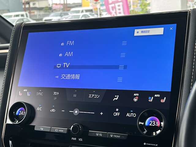トヨタ アルファードハイブリット Z 愛知県 2024(令6)年 1.4万km プラチナホワイトパールマイカ 禁煙車/法人ワンオーナー/純正メーカーナビ、TV/パノラミックビューモニター/レザーシート/独立サンルーフ/両側パワースライドドア/トヨタチームメイト/自動駐車/ユニバーサルステップ/ヘッドアップディスプレイ/ブラインドスポットモニター/フリップダウンモニター/デジタルインナーミラー/アダプティプクルーズコントロール/レーンキープアシスト/パドルシフト/置くだけ充電/HDMI/前後コーナーセンサー/クリアランスソナー/Bluetooth/Miracast/ステアリングリモコン/ハンドルヒーター/シートヒーター（セカンドシートまで）/エアシート（セカンドシートまで）/パワーシート/メモリーシート/オットマン/後席サンシェード/AUTOHOLD/純正18アルミ/純正フロアマット/ドアバイザー/フォグランプ/LEDヘッドライト/AUTOライト/AUTOハイビーム/ETC/前後ドラレコ/スペアキー/取扱説明書/保証書