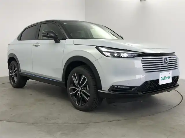 ホンダ ヴェゼル ハイブリッド e:HEV Z PLaYパッケージ 愛知県 2025(令7)年 0.1千km パールⅡ ディスプレイオーディオ　/バックカメラ　/置くだけ充電　/パドルシフト　/追従クルコン　/パワーバックドア　/ＥＴＣ２．０　/ＢＳＭ　/シートヒーター　/ハーフレザー　/タイプＣ　/フルセグＴＶ　/ステアヒーター