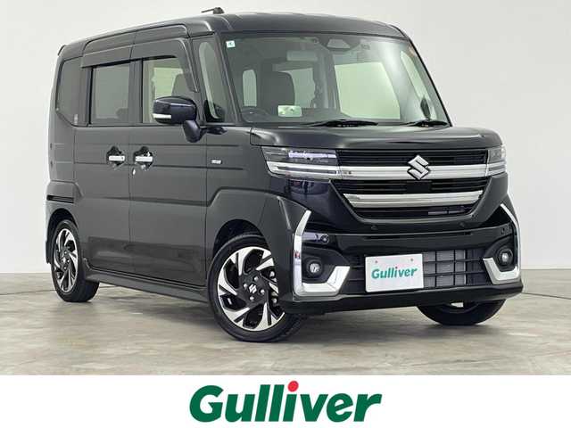 スズキ スペーシア カスタム HYBRID XS 群馬県 2024(令6)年 0.7万km ブルーイッシュブラックパール3 社外８インチナビ　バックカメラ　両側パワースライドドア　レーダークルーズコントロール　オットマン　シートヒーター　純正１５インチＡＷ　ステアリングリモコン　ＨＵＤ　コーナーセンサー　ＥＴＣ　禁煙車