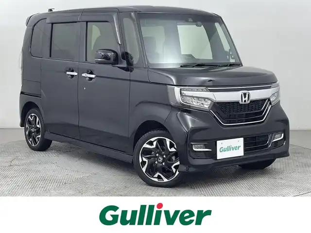 ホンダ Ｎ ＢＯＸ カスタム G L ターボ ホンダセンシング 道央・札幌 2019(令1)年 4.4万km クリスタルブラックパール ・４WD/・Gathersナビゲーション（VXM-240VFi）/　CD/DVD/フルセグ/SD/USB/BT/iPod/・ビルトインETC/・バックカメラ/・純正前方録画ドライブレコーダー/・両側パワースライドドア/・ホンダセンシング/・レーダークルーズコントロール/・レーンキープアシスト/・横滑り防止装置/・衝突軽減ブレーキ/・先行車発進通知/・ロードサインアシスト/・ハーフレザーシート/・前席シートヒーター/・純正フロアマット/・LEDヘッドライト/・オートライト/・スマートキー/・プッシュスタート/・純正AW15インチ/・MTモード付AT/・後方パーキングソナー/・革巻きステアリング/・スイテアリングスイッチ/・フロントフォグライト/・ドアバイザー/・チップアップシーート
