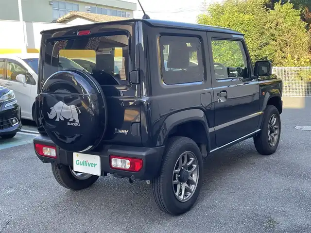 スズキ ジムニー XC 静岡県 2024(令6)年 0.8万km ブルーイッシュブラックパール3 ワンオーナー/背面タイヤハードカバー/衝突軽減ブレーキ/レーンキープアシスト/レーダークルーズコントロール/バックソナー/LEDライト/前席シートヒーター/純正16インチAW/スマートキー×2/保証書/取扱説明書