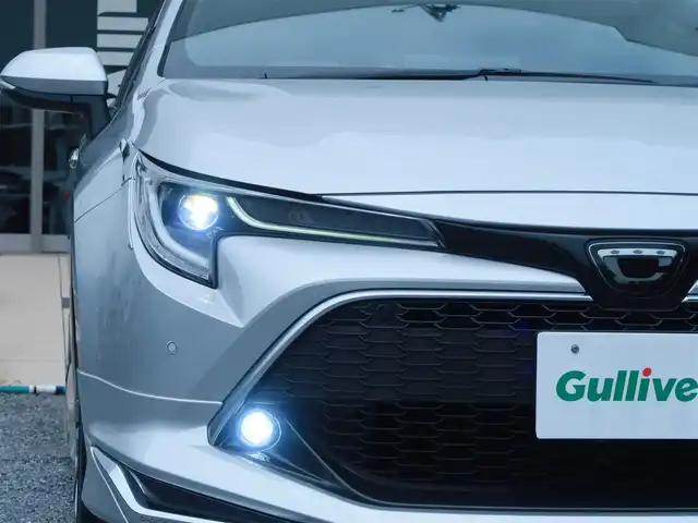 トヨタ カローラ スポーツ G Z 千葉県 2022(令4)年 1.9万km シルバーM モデリスタエアロ(F・S・R)/モデリスタ ドアハンドルプロテクター/運転席ドアのみ装着　未使用品1個有り/モデリスタ ドアハンドルガーニッシュ/BLITZ車高調/ENKEI PerformanceLine PF07 19インチAW/KENSTYLEステアリング TD03(レッドステッチ)/純正ステアリング有り/前後ドライブレコーダー/（CSD-790FHG・CSD-CM01)/純正フロアマット/純正ドアバイザー/純正レインクリアリングブルーミラー/通常ミラー有り/純正ディスプレイオーディオ/・AM/FM/CD/DVD/Bluetooth/フルセグTV/デジタルインナーミラー/ブラインドスポットモニター(BSM)/スマートキー×2本/ビルトインETC/ハーフレザー(赤/黒)/前席シートヒーター /パドルシフト/レーダークルーズコントロール/レーンキープアシスト/衝突軽減ブレーキ/オートハイビーム/LEDヘッドライト/LEDフォグランプ/ヘッドライトレベライザー/電動パーキングブレーキ/ブレーキホールド機能/先行車発進お知らせ機能/横滑り防止装置/USB充電/取扱説明書/保証書
