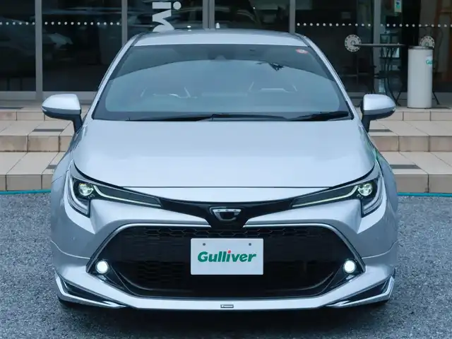 トヨタ カローラ スポーツ G Z 千葉県 2022(令4)年 1.9万km シルバーM モデリスタエアロ(F・S・R)/モデリスタ ドアハンドルプロテクター/運転席ドアのみ装着　未使用品1個有り/モデリスタ ドアハンドルガーニッシュ/BLITZ車高調/ENKEI PerformanceLine PF07 19インチAW/KENSTYLEステアリング TD03(レッドステッチ)/純正ステアリング有り/前後ドライブレコーダー/（CSD-790FHG・CSD-CM01)/純正フロアマット/純正ドアバイザー/純正レインクリアリングブルーミラー/通常ミラー有り/純正ディスプレイオーディオ/・AM/FM/CD/DVD/Bluetooth/フルセグTV/デジタルインナーミラー/ブラインドスポットモニター(BSM)/スマートキー×2本/ビルトインETC/ハーフレザー(赤/黒)/前席シートヒーター /パドルシフト/レーダークルーズコントロール/レーンキープアシスト/衝突軽減ブレーキ/オートハイビーム/LEDヘッドライト/LEDフォグランプ/ヘッドライトレベライザー/電動パーキングブレーキ/ブレーキホールド機能/先行車発進お知らせ機能/横滑り防止装置/USB充電/取扱説明書/保証書