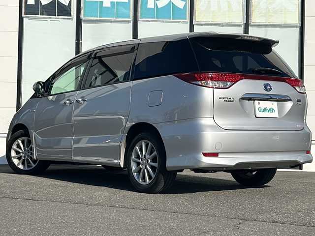 トヨタ エスティマ ハイブリッド X 山形県 2015(平27)年 10.1万km シルバーM 禁煙車/４WD/純正SDナビ/（AM/FM/TV/CD/DVD/SD/BT)/クルーズコントロール/ETC/フロントワイパーデアイサー/AC100V電源/nanoe/バックカメラ/片側パワースライドドア/オットマン/ステアリングスイッチ/ドアバイザー/電動格納ミラー/フォグランプ/純正AW