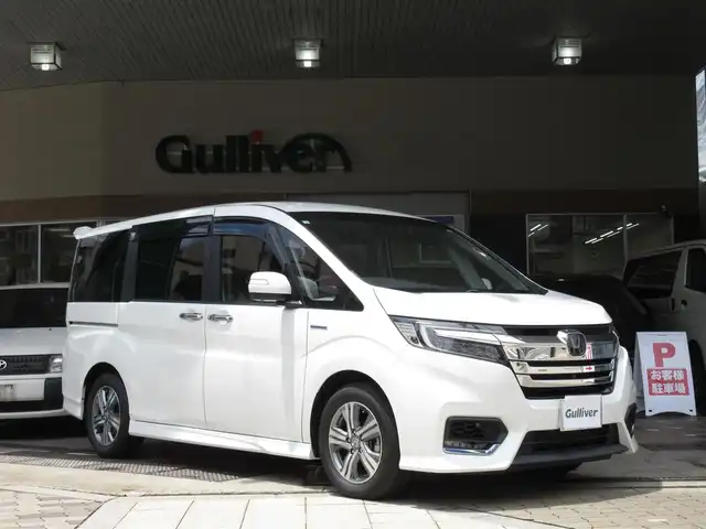 ホンダ ステップワゴン スパーダ ハイブリッド G EX ホンダセンシング 大阪府 2018(平30)年 1.6万km パール ワンオーナー/純正１０インチインターナビ、フルセグＴＶ、/ＣＤ、ＤＶＤ、Ｂｌｕｅｔｏｏｔｈ、ＨＤＭＩ/純正前後カメラドライブレコーダー/両側パワースライドドア/マルチビューカメラ/ホンダセンシング/ＥＴＣ/わくわくゲート/プッシュスタート/スマートキー２個/ＬＥＤヘッドライト/ステアリングスイッチ/ハーフレザー調シート/純正１６インチアルミホイール