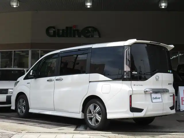ホンダ ステップワゴン スパーダ ハイブリッド G EX ホンダセンシング 大阪府 2018(平30)年 1.6万km パール ワンオーナー/純正１０インチインターナビ、フルセグＴＶ、/ＣＤ、ＤＶＤ、Ｂｌｕｅｔｏｏｔｈ、ＨＤＭＩ/純正前後カメラドライブレコーダー/両側パワースライドドア/マルチビューカメラ/ホンダセンシング/ＥＴＣ/わくわくゲート/プッシュスタート/スマートキー２個/ＬＥＤヘッドライト/ステアリングスイッチ/ハーフレザー調シート/純正１６インチアルミホイール