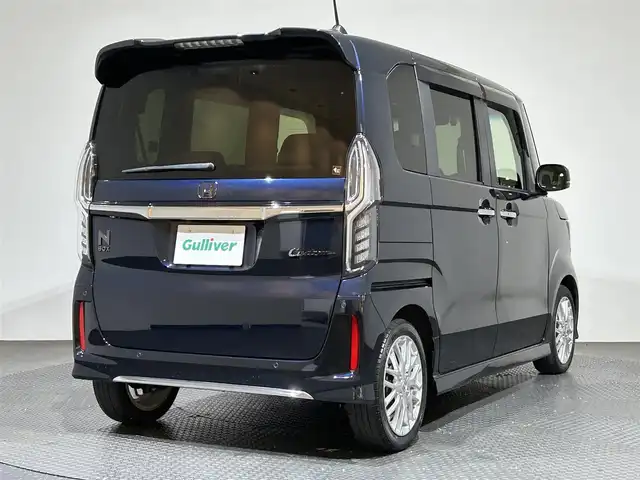 ホンダ Ｎ ＢＯＸ カスタム L ターボ 愛媛県 2021(令3)年 2.6万km ミッドナイトブルービームM ・純正８インチナビ/（フルセグＴＶ・ＢＴ・ＣＤ・ＤＶＤ・ＦＭ・ＡＭ・ＵＳＢ・ａｐｐｌｅｃａｒｐｌａｙ）/・バックカメラ　/・前後ドラレコ　/・ＥＴＣ　/・衝突軽減ブレーキ　/・レーンキープアシスト　/・レーダークルーズコントロール/・両側電動ドア/・オートマチックハイビーム/・前後コーナーセンサー/・DN席シートヒーター