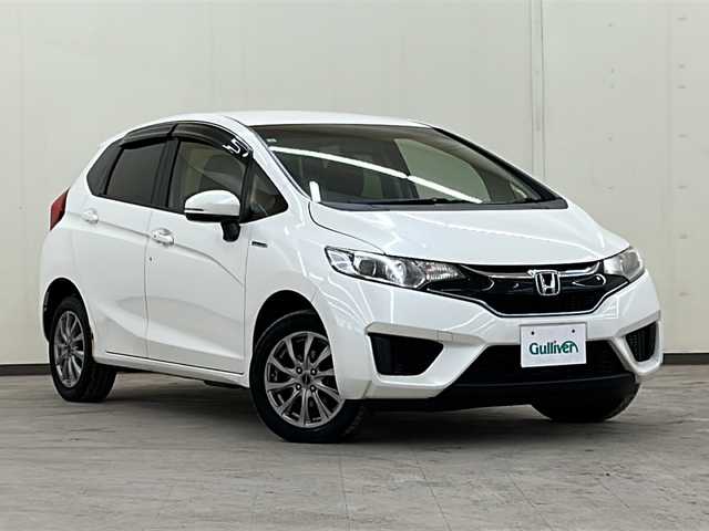 ホンダ フィット ハイブリット Fパッケージ コンフォートED 道央・札幌 2017(平29)年 14.2万km プレミアムホワイトパールⅡ 社外ディスプレイオーディオ//4WD//バックカメラ//アイドリングストップ//ドアバイザー//プッシュスタート//ETC//シートヒータ//エンジンスターター//オートライト