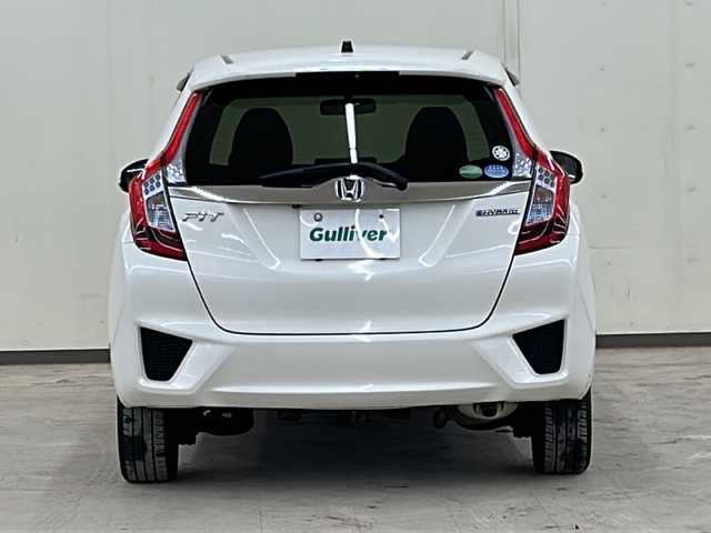 ホンダ フィット ハイブリット Fパッケージ コンフォートED 道央・札幌 2017(平29)年 14.2万km プレミアムホワイトパールⅡ 社外ディスプレイオーディオ//4WD//バックカメラ//アイドリングストップ//ドアバイザー//プッシュスタート//ETC//シートヒータ//エンジンスターター//オートライト