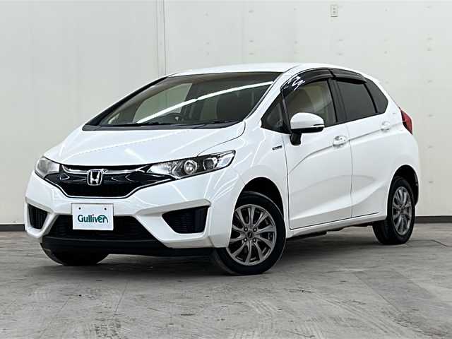 ホンダ フィット ハイブリット Fパッケージ コンフォートED 道央・札幌 2017(平29)年 14.2万km プレミアムホワイトパールⅡ 社外ディスプレイオーディオ//4WD//バックカメラ//アイドリングストップ//ドアバイザー//プッシュスタート//ETC//シートヒータ//エンジンスターター//オートライト