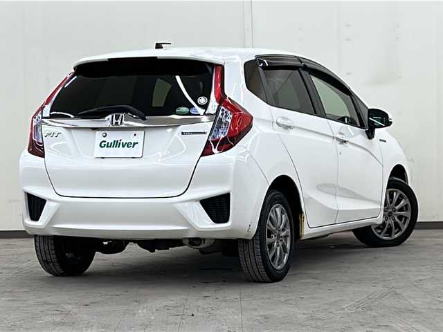 ホンダ フィット ハイブリット Fパッケージ コンフォートED 道央・札幌 2017(平29)年 14.2万km プレミアムホワイトパールⅡ 社外ディスプレイオーディオ//4WD//バックカメラ//アイドリングストップ//ドアバイザー//プッシュスタート//ETC//シートヒータ//エンジンスターター//オートライト