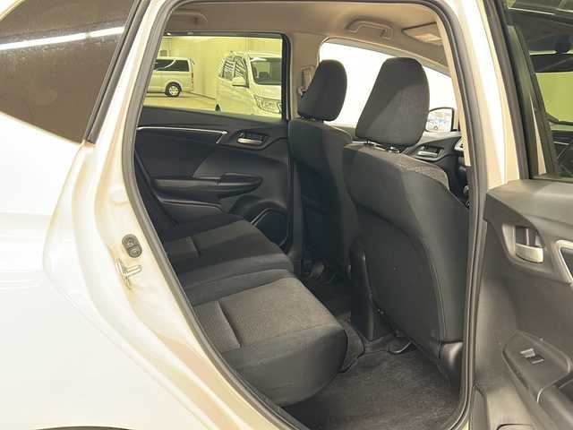 ホンダ フィット ハイブリット Fパッケージ コンフォートED 道央・札幌 2017(平29)年 14.2万km プレミアムホワイトパールⅡ 社外ディスプレイオーディオ//4WD//バックカメラ//アイドリングストップ//ドアバイザー//プッシュスタート//ETC//シートヒータ//エンジンスターター//オートライト