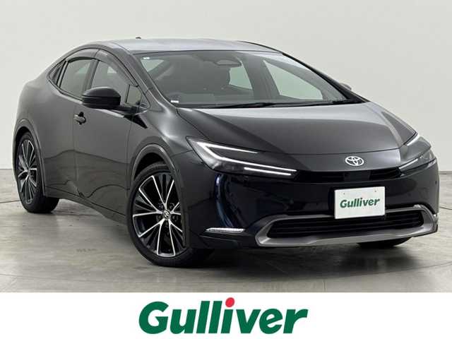 トヨタ プリウス Z 福岡県 2023(令5)年 0.9万km アティチュードブラックマイカ ワンオーナー　/純正１２．３型ＤＡナビ/フルセグTV　/全方位カメラ　/ワイヤレス充電　/デジタルインナーミラー　/ビルトインETC２．０　/トヨタセーフティセンス　/衝突軽減ブレーキ　/レーンキープ　/ブラインドスポットモニター　/アクセル踏み間違防止　/パーキングアシスト　/シートメモリー付きパワーシート　/シートベンチレーション/ヒーター　/ステアリングヒーター　/パワーバックドア　/純正１９インチアルミホイール　/ＬＥＤヘッドライト