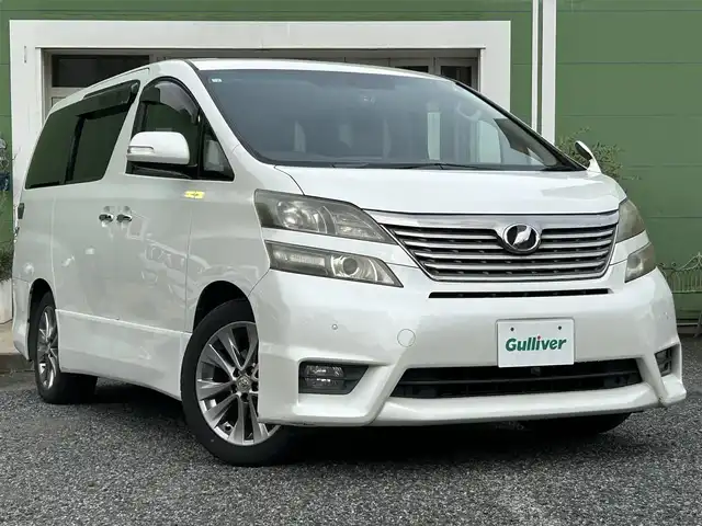 トヨタ ヴェルファイア 2．4Z プラチナセレクションⅡ 埼玉県 2010(平22)年 11.9万km ホワイトパールクリスタルシャイン Wサンルーフ/純正ナビTV/社外フリップダウンモニター/バックカメラ/両側パワースライドドア/パワーバックドア/ビルトインETC/前後ドライブレコーダー/横滑防止装置/クリアランスソナー/純正アルミホイール/二列目オットマン/プッシュスタート/オートライト/HID ヘッドライト/取扱説明書