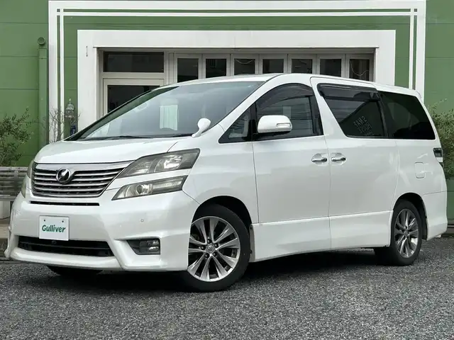 トヨタ ヴェルファイア 2．4Z プラチナセレクションⅡ 埼玉県 2010(平22)年 11.9万km ホワイトパールクリスタルシャイン Wサンルーフ/純正ナビTV/社外フリップダウンモニター/バックカメラ/両側パワースライドドア/パワーバックドア/ビルトインETC/前後ドライブレコーダー/横滑防止装置/クリアランスソナー/純正アルミホイール/二列目オットマン/プッシュスタート/オートライト/HID ヘッドライト/取扱説明書