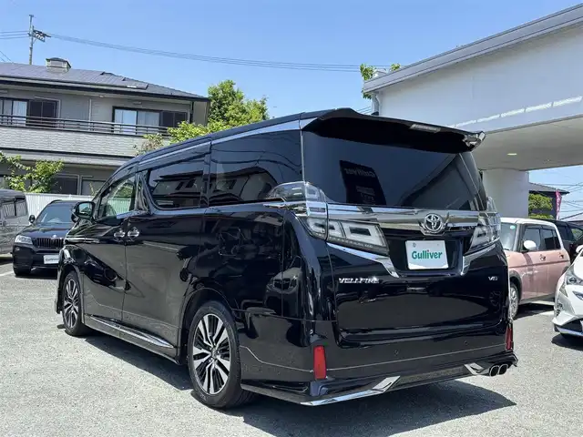 トヨタ ヴェルファイア Z Gエディション 熊本県 2018(平30)年 7.1万km ブラック ワンオーナー/モデリスタフルエアロ/モデリスタマフラー/モデリスタミラーガーニッシュ/モデリスタバックドアガーニッシュ/純正ディーラーナビ(NSZT-Y66T)/【フルセグTV/CD/DVD/Bluetooth】/バックカメラ/純正フリップダウンモニター(V12T-R66C)/両側パワースライドドア/衝突被害軽減システム/レーンキープアシスト/レーダークルーズコントロール/コーナーセンサー/合皮シート/前席パワーシート（D席メモリ付き）/前席シートヒーター/前席エアーシート/２列目オットマン/ハンドルヒーター/パワーバックドア/純正18インチアルミホイル/オートLEDライト/オートマチックハイビーム/ビルトインETC/純正フロアマット/横滑り防止装置/盗難防止装置/取扱説明書/保証書