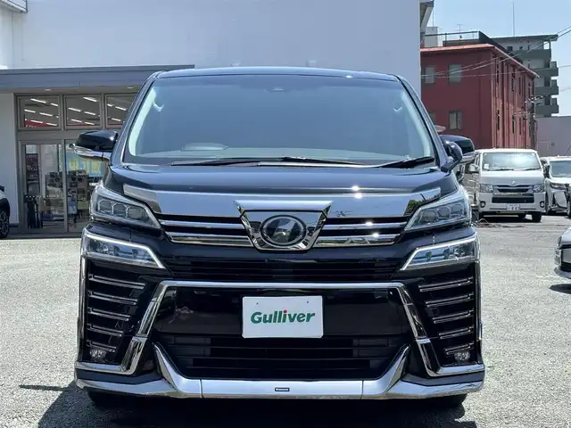 トヨタ ヴェルファイア Z Gエディション 熊本県 2018(平30)年 7.1万km ブラック ワンオーナー/モデリスタフルエアロ/モデリスタマフラー/モデリスタミラーガーニッシュ/モデリスタバックドアガーニッシュ/純正ディーラーナビ(NSZT-Y66T)/【フルセグTV/CD/DVD/Bluetooth】/バックカメラ/純正フリップダウンモニター(V12T-R66C)/両側パワースライドドア/衝突被害軽減システム/レーンキープアシスト/レーダークルーズコントロール/コーナーセンサー/合皮シート/前席パワーシート（D席メモリ付き）/前席シートヒーター/前席エアーシート/２列目オットマン/ハンドルヒーター/パワーバックドア/純正18インチアルミホイル/オートLEDライト/オートマチックハイビーム/ビルトインETC/純正フロアマット/横滑り防止装置/盗難防止装置/取扱説明書/保証書