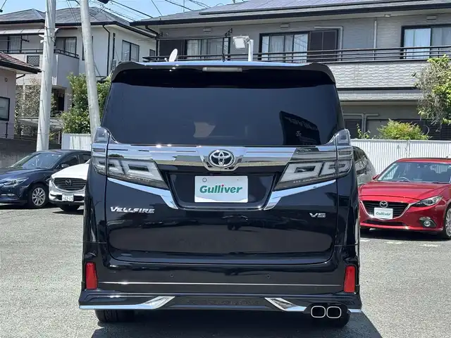 トヨタ ヴェルファイア Z Gエディション 熊本県 2018(平30)年 7.1万km ブラック ワンオーナー/モデリスタフルエアロ/モデリスタマフラー/モデリスタミラーガーニッシュ/モデリスタバックドアガーニッシュ/純正ディーラーナビ(NSZT-Y66T)/【フルセグTV/CD/DVD/Bluetooth】/バックカメラ/純正フリップダウンモニター(V12T-R66C)/両側パワースライドドア/衝突被害軽減システム/レーンキープアシスト/レーダークルーズコントロール/コーナーセンサー/合皮シート/前席パワーシート（D席メモリ付き）/前席シートヒーター/前席エアーシート/２列目オットマン/ハンドルヒーター/パワーバックドア/純正18インチアルミホイル/オートLEDライト/オートマチックハイビーム/ビルトインETC/純正フロアマット/横滑り防止装置/盗難防止装置/取扱説明書/保証書