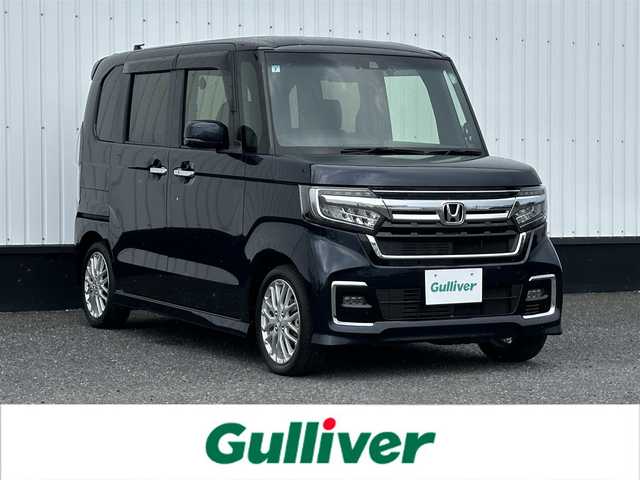 ホンダ Ｎ ＢＯＸ カスタム L ターボ 千葉県 2021(令3)年 2.7万km ミッドナイトブルービームM 純正メモリナビ/(フルセグTV CD DVD BT FM AM)/バックカメラ/前後ドライブレコーダー/衝突被害軽減システム/車線逸脱警報/クルーズコントロール/ハーフレザーシート/両側パワースライドドア/横滑り防止装置/ETC/アイドリングストップ/LEDヘッドライト/フォグランプ/オートライト/ウィンカーミラー/電動格納ミラー/純正15インチAW/シートヒーター/シートリフター/プッシュスタート/スマートキー/フロアマット/ドアバイザー