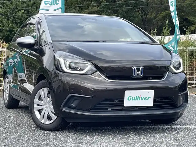 ホンダ フィット e:HEVホーム 埼玉県 2020(令2)年 2.2万km プレミアムグラマラスブロンズP 純正ナビTV/バックカメラ/前後ドラレコ/ETC/クリアランスソナー/オールシーズンタイヤ/プッシュスタート/スマートキー/走行２１１５３キロ/保証書付整備手帳/取扱説明書