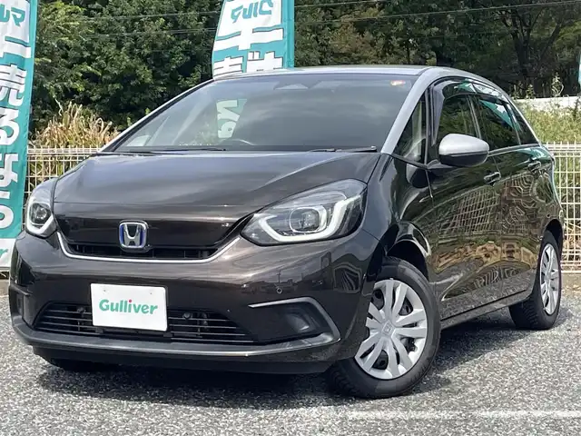 ホンダ フィット e:HEVホーム 埼玉県 2020(令2)年 2.2万km プレミアムグラマラスブロンズP 純正ナビTV/バックカメラ/前後ドラレコ/ETC/クリアランスソナー/オールシーズンタイヤ/プッシュスタート/スマートキー/走行２１１５３キロ/保証書付整備手帳/取扱説明書