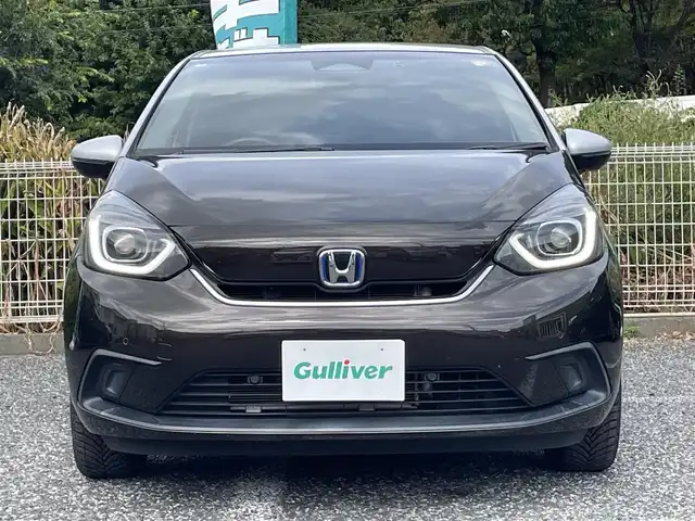 ホンダ フィット e:HEVホーム 埼玉県 2020(令2)年 2.2万km プレミアムグラマラスブロンズP 純正ナビTV/バックカメラ/前後ドラレコ/ETC/クリアランスソナー/オールシーズンタイヤ/プッシュスタート/スマートキー/走行２１１５３キロ/保証書付整備手帳/取扱説明書