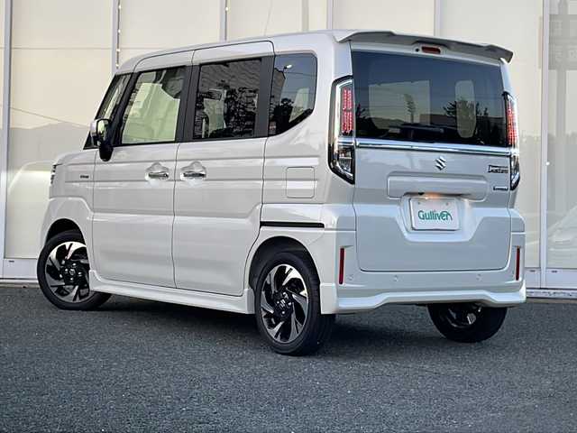 スズキ スペーシア カスタム HYBRID XS 福岡県 2025(令7)年 0.1万km ピュアホワイトP 純正9インチナビ/　（AppleCarPlay/FM/AM/フルセグ/Bluetooth)/全方位カメラ/HUD/ステアリングヒーター/ヘッドライトレベライザー/両側パワースライドドア/レーダークルーズコントロール/革巻きステアリング/ディーラーOPフロアマット/ディーラーOPドアハンドルプロテクター/シートヒーター/横滑り防止装置/コーナーセンサー/レーンキープアシスト/衝突軽減システム/オートライト/LEDライト/純正ホイール/電格ミラー