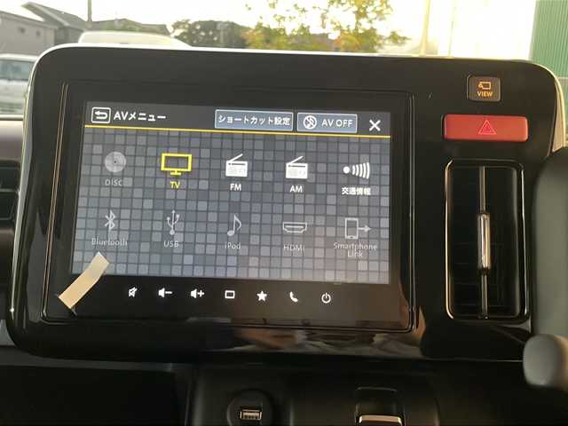 スズキ スペーシア カスタム HYBRID XS 福岡県 2025(令7)年 0.1万km ピュアホワイトP 純正9インチナビ/　（AppleCarPlay/FM/AM/フルセグ/Bluetooth)/全方位カメラ/HUD/ステアリングヒーター/ヘッドライトレベライザー/両側パワースライドドア/レーダークルーズコントロール/革巻きステアリング/ディーラーOPフロアマット/ディーラーOPドアハンドルプロテクター/シートヒーター/横滑り防止装置/コーナーセンサー/レーンキープアシスト/衝突軽減システム/オートライト/LEDライト/純正ホイール/電格ミラー