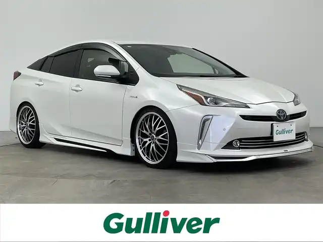 トヨタ プリウス Sツーリングセレクション 大分県 2019(平31)年 4.7万km ホワイトパールクリスタルシャイン モデリスタエアロ/（フロント/サイド/リア）/トヨタセーフティーセンス/・プリクラッシュセーフティー/・LDA/・オートハイビーム/・踏み間違え防止/・レーダークルーズコントロール/TEIN車高調/純正ナビ/（フルセグ/CD/DVD/Bluetooth）/ビルトインETC/バックカメラ/前席シートヒーター/前方ドライブレコーダー/ステアリングスイッチ/オートリトラミラー/スマートキー・プッシュスタート/社外19インチアルミホイール/保証書・取扱説明書