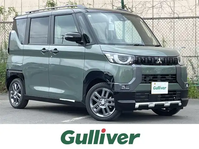 三菱 デリカミニ T プレミアム 東京都 2025(令7)年 0.1万km未満 緑 届出済未使用車/純正ディスプレイオーディオ/マルチアラウンドモニター/衝突被害軽減/車線逸脱警報/シートヒーター/両側パワースライドドア/ステアリングヒーター/ステアリングスイッチ/スマートキー