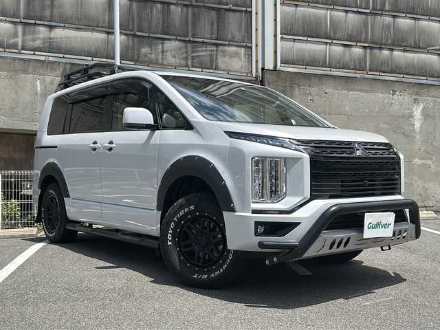 三菱 デリカＤ：５ G パワーパッケージ 愛知県 2022(令4)年 2.6万km ホワイトダイヤモンド 4WD/7人乗り/ディーゼルターボ車/ワンオーナー/アルパイン11インチナビ/フルセグTV・CD・DVD・Bluetooth・SD・HDMI/バックカメラ/全方位カメラ/JAOSドアハンドルプロテクター/JAOSマッドガード/JAOSはしご/ルーフラック/サイドステップ/e-アシスト/・衝突被害軽減ブレーキシステム/・車線逸脱警報システム/・レーダークルーズコントロールシステム/・オートマチックハイビーム/・誤発進抑制機能（前進時）/・後側方車両検知警報システム/・後退時車両検知警報システム/ワンタッチ開閉両側パワースライドドア/パワーバックドア/パドルシフト/LEDヘッドランプ/LEDフォグランプ/前席シートヒーター/ステアリングヒーター/前席ドライブレコーダー/ETC/社外16インチアルミホイール/純正18インチアルミホイール 車内積み込み225/55R18/スマートキー/プッシュスタート/保証書/取扱説明書/スペアスマートキー