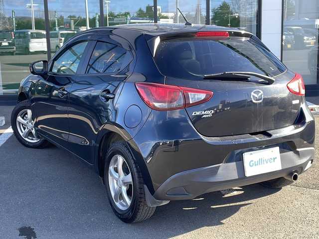 マツダ デミオ XD 道東・釧路十勝 2015(平27)年 4.8万km ジェットブラックマイカ ・４WD/・純正SDメモリナビ/（フルセグ FFM AM BT CD DVD)/・バックカメラ/・MT付きAT/・ヘッドライトレベライザー/・ドアバイザー/・電動格納ミラー/・ウィンカーミラー/・横すべり防止機能/・ステアリングスイッチ/・夏タイヤ積込/（185/65/R15　2015年製造）