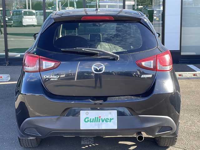 マツダ デミオ XD 道東・釧路十勝 2015(平27)年 4.8万km ジェットブラックマイカ ・４WD/・純正SDメモリナビ/（フルセグ FFM AM BT CD DVD)/・バックカメラ/・MT付きAT/・ヘッドライトレベライザー/・ドアバイザー/・電動格納ミラー/・ウィンカーミラー/・横すべり防止機能/・ステアリングスイッチ/・夏タイヤ積込/（185/65/R15　2015年製造）