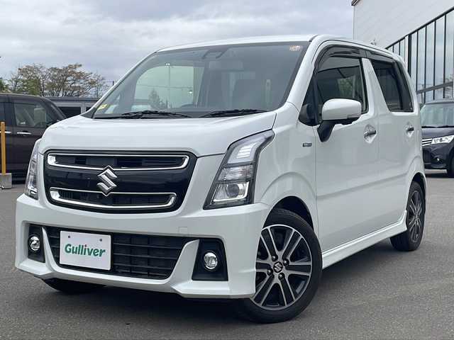 スズキ ワゴンＲ スティングレー HYBRID T 青森県 2019(平31)年 4.5万km ピュアホワイトP ・４WD/・禁煙車/・8型社外SDナビ/・フルセグ/DVD/AM/FM/・衝突被害軽減ブレーキ/・全方位カメラ/・クルーズコントロール/・横滑り防止装置/・盗難防止装置/・レーンキープアシスト/・ヘッドアップディスプレイ/・スマートキー/・スペアキー/・オートライト/・LEDライト/・フォグランプ/・ダブルエアバック/・前席シートヒーター/・ベンチシート/・フルフラットシート/・純正フロアマット/・純正アルミホイール/・純正ドライブレコーダー/・パドルシフト/・ETC/・取扱説明書
