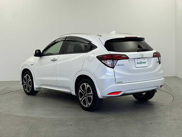 ホンダ ヴェゼル ハイブリッド Z 栃木県 2015(平27)年 9.1万km ホワイトオーキッドパール 禁煙車/衝突軽減ブレーキ/クルーズコントロール/社外メモリーナビ/・フルセグ/AM/FM/CD/DVD/BT/HDMI/バックカメラ/前側ドライブレコーダ―/ETC/前席シートヒーター/電動パーキング/LEDヘッドライト/オートライト/フォグランプ/パドルシフト/17インチ純正AW/純正フロアマット/スペアキー/取扱説明書/保証書