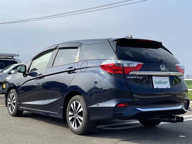 ホンダ シャトル ハイブリッド X 佐賀県 2015(平27)年 7.4万km ミッドナイトブルービームM 純正HDDナビゲーション/・フルセグTV/CD/DVD/USB/HDMI/Bluetooth/バックカメラ/シティブレーキアクティブシステム(CTBA)/横滑り防止装置/クルーズコントロール/ビルトインETC/ハーフレザーシート/ISOFIX対応/革巻きステアリング/ステアリングリモコン/社外(柿本)マフラー/純正15インチアルミホイール/純正LEDヘッドライト/純正LEDフォグライト/純正フロアマット/純正ドアバイザ―/スペアキー１本